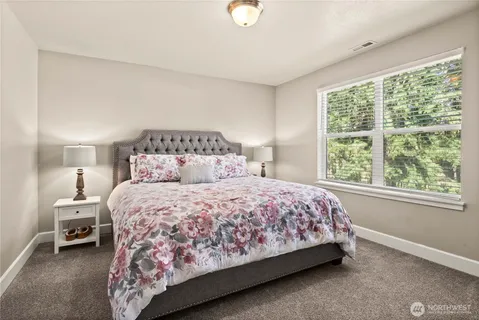 a bedroom with a bed and window