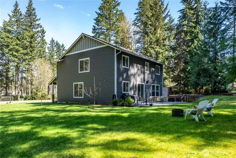 a front view of house with yard and green space
