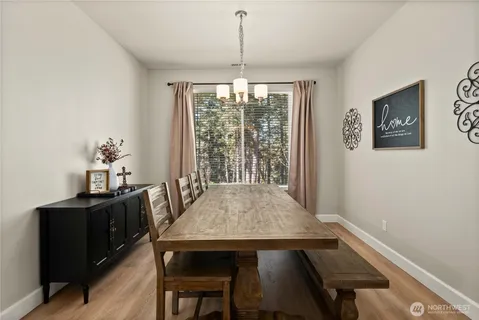 a view of a dining room with furniture window and outside view