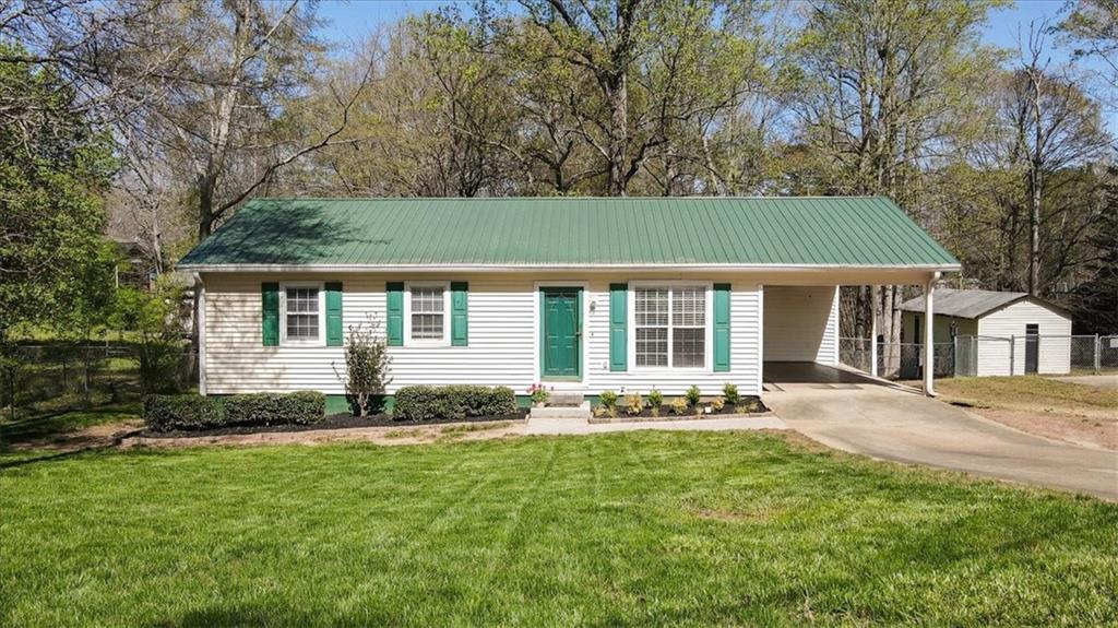 5638 Nacoochee Street Lula, GA 30554 - Photo 2 of 29 a front view of a house with a yard