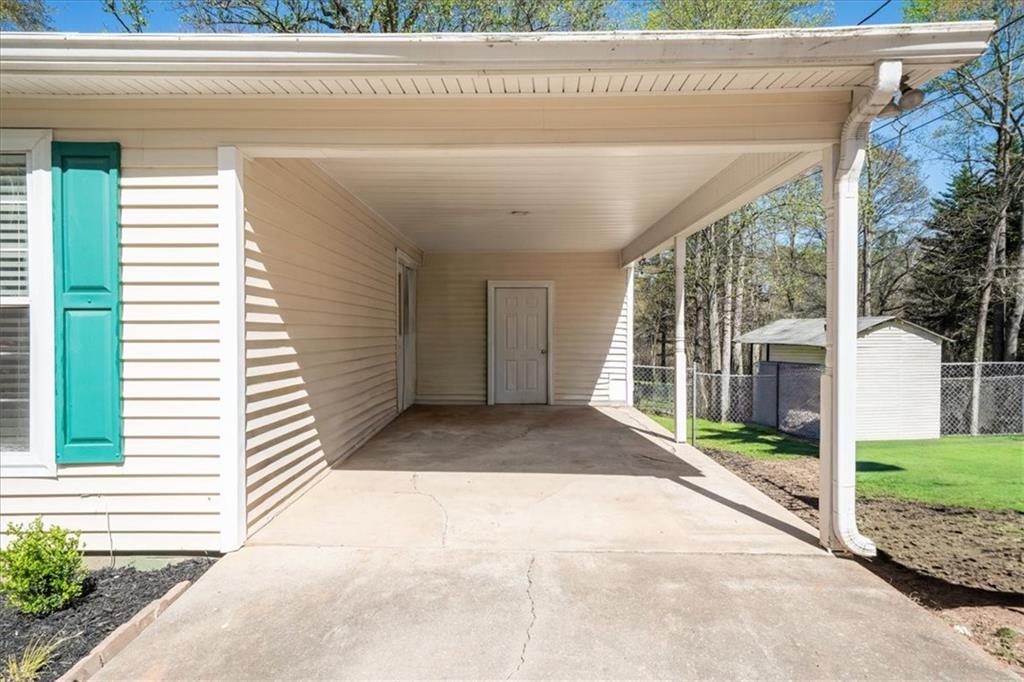 5638 Nacoochee Street Lula, GA 30554 - Photo 21 of 29 a view of a house with a small yard and plants