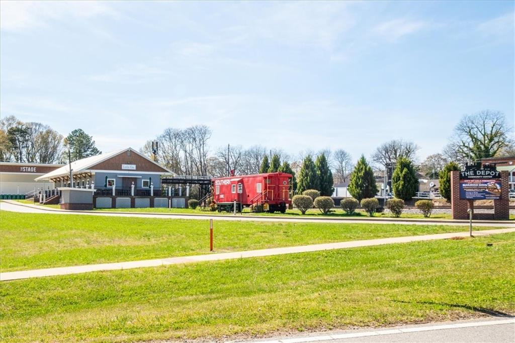 5638 Nacoochee Street Lula, GA 30554 - Photo 29 of 29 a view of a house with a big yard and large trees