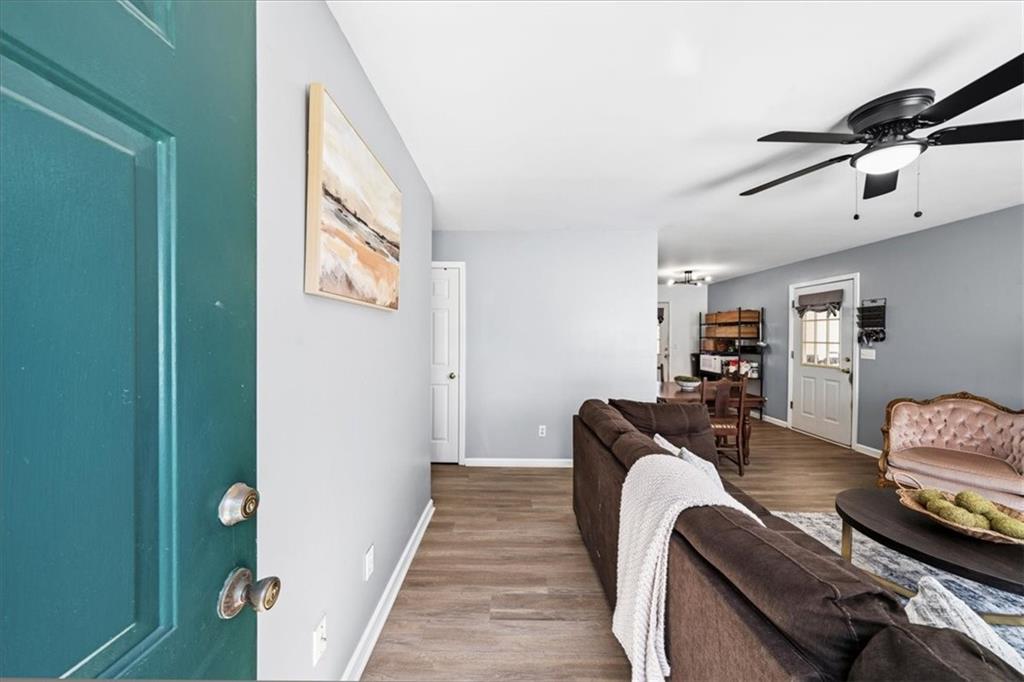 5638 Nacoochee Street Lula, GA 30554 - Photo 5 of 29 a bedroom with furniture and wooden floor