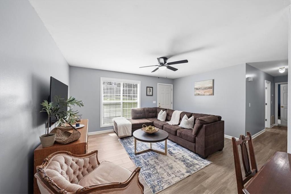 5638 Nacoochee Street Lula, GA 30554 - Photo 7 of 29 a living room with furniture potted plant and a window