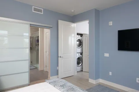 a view of a storage & utility room with a washer and dryer