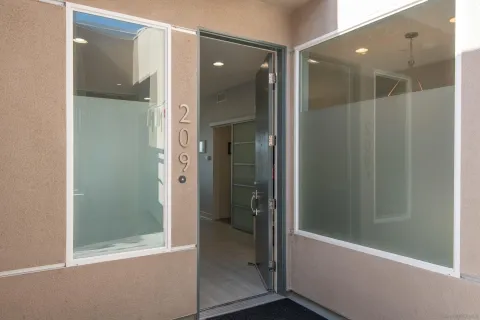 a bathroom with a glass shower door and a bathtub