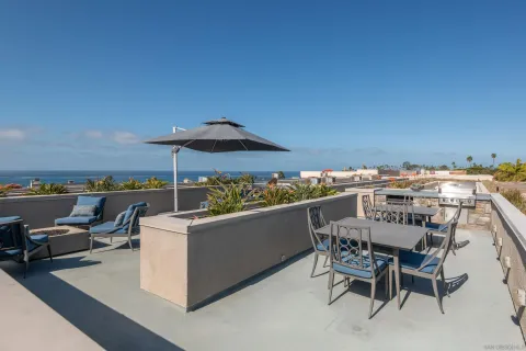 a view of a terrace with furniture and stove
