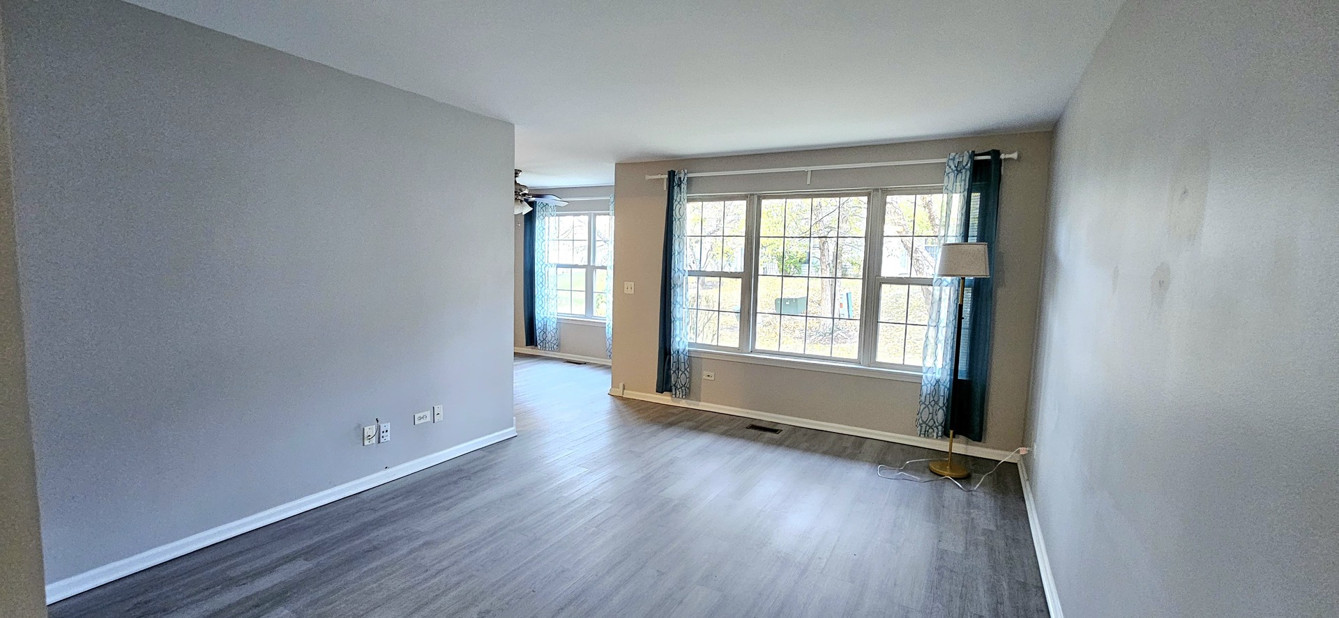 1248 North Red Oak Circle, Unit 2 Round Lake Beach, IL 60073 - Photo 11 of 21 an empty room with wooden floor and windows
