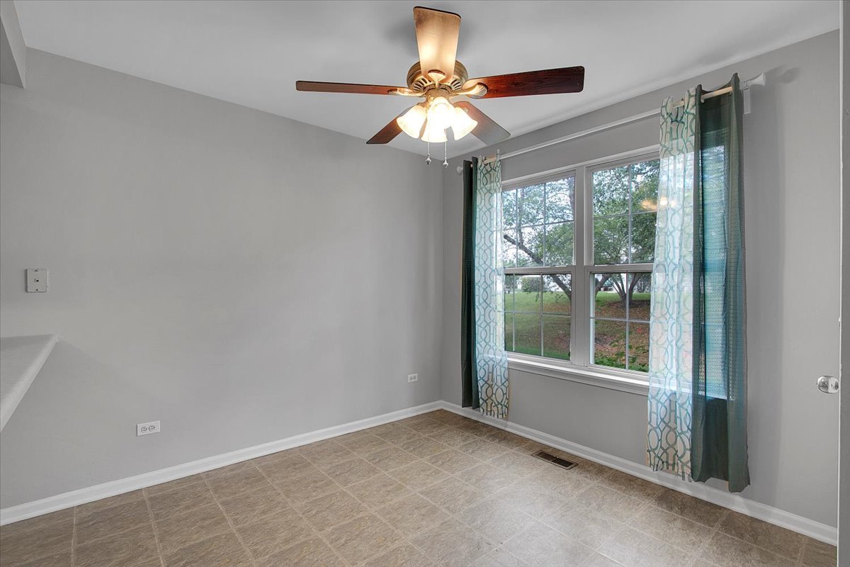 1248 North Red Oak Circle, Unit 2 Round Lake Beach, IL 60073 - Photo 14 of 21 a view of an empty room with a window