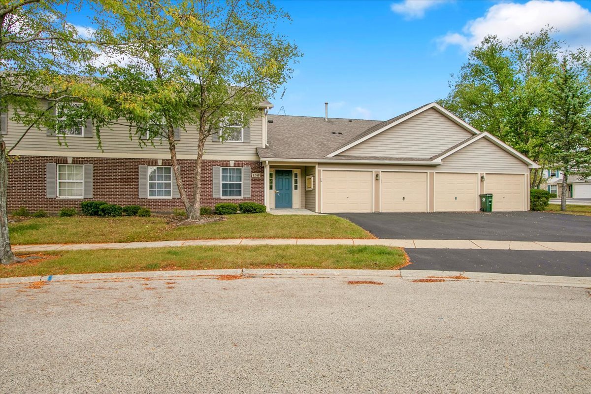 1248 North Red Oak Circle, Unit 2 Round Lake Beach, IL 60073 - Photo 2 of 21 a view of house with outdoor space and large trees