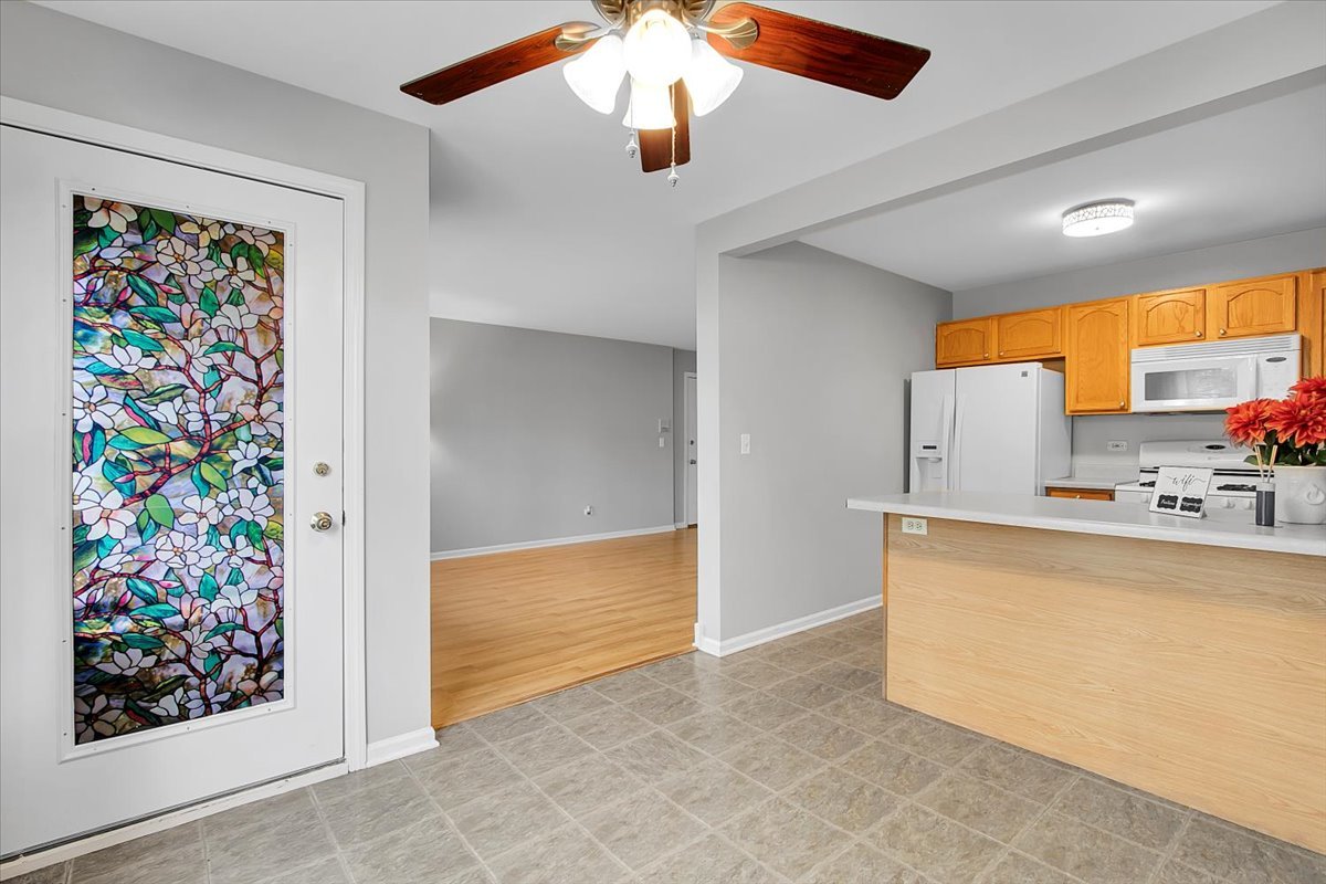 1248 North Red Oak Circle, Unit 2 Round Lake Beach, IL 60073 - Photo 8 of 21 a view of kitchen with furniture and natural light