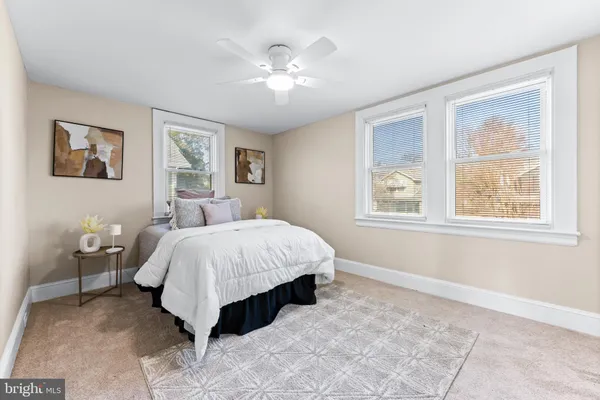 a spacious bedroom with a large bed and a window