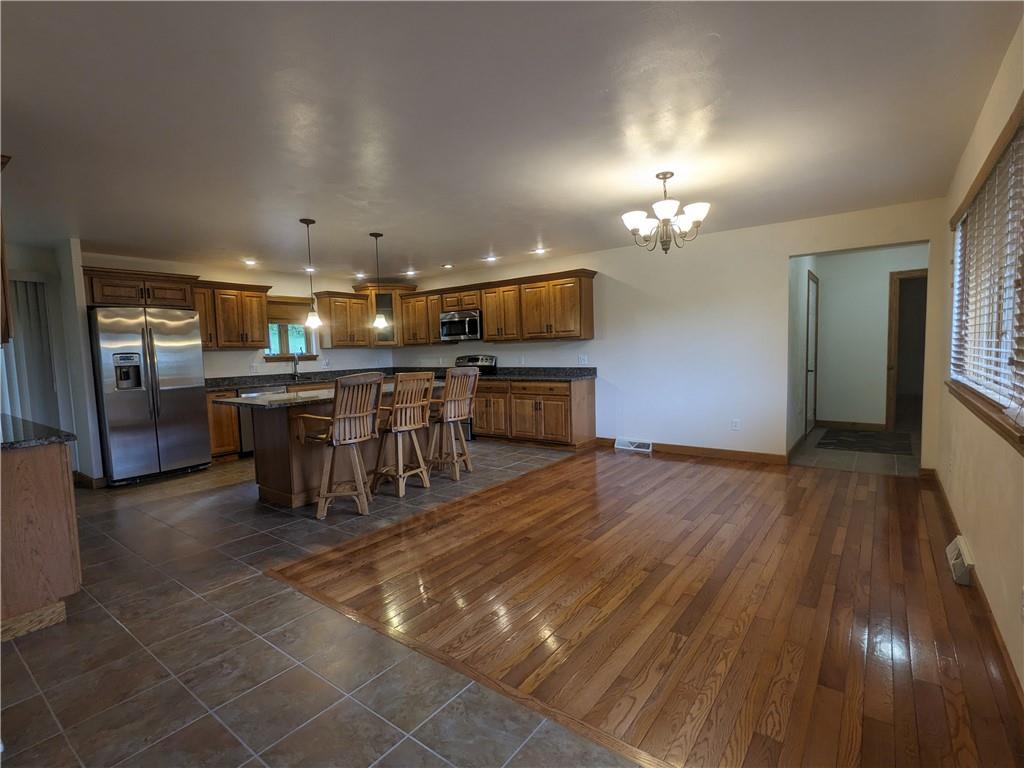350 American Legion Road Latrobe, PA 15650 - Photo 12 of 45 a view of a room with kitchen appliances and a chandelier