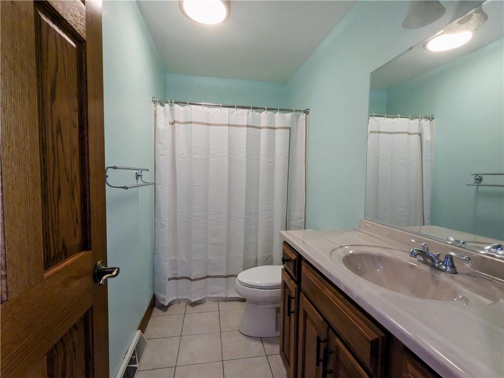 350 American Legion Road Latrobe, PA 15650 - Photo 18 of 45 a bathroom with a sink a toilet and shower