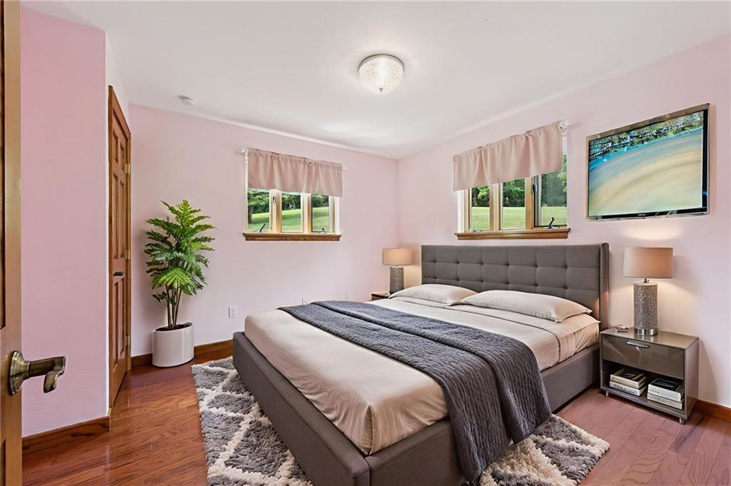 350 American Legion Road Latrobe, PA 15650 - Photo 20 of 45 a bedroom with a bed and a painting on the wall