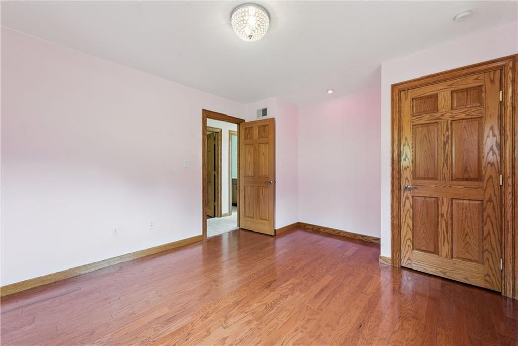 350 American Legion Road Latrobe, PA 15650 - Photo 22 of 45 wooden floor in an empty room with a window