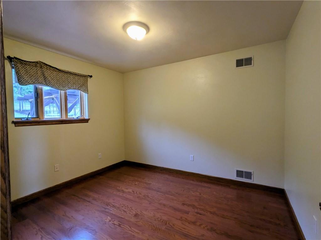 350 American Legion Road Latrobe, PA 15650 - Photo 23 of 45 an empty room with wooden floor and windows