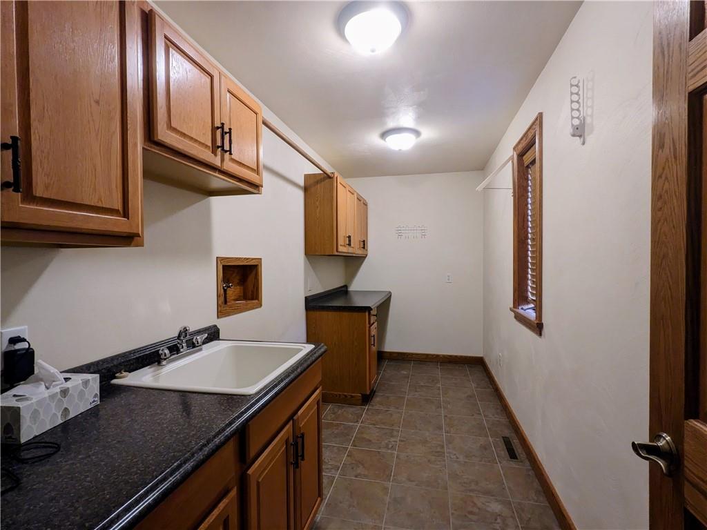 350 American Legion Road Latrobe, PA 15650 - Photo 25 of 45 a kitchen with stainless steel appliances granite countertop a sink refrigerator and cabinets