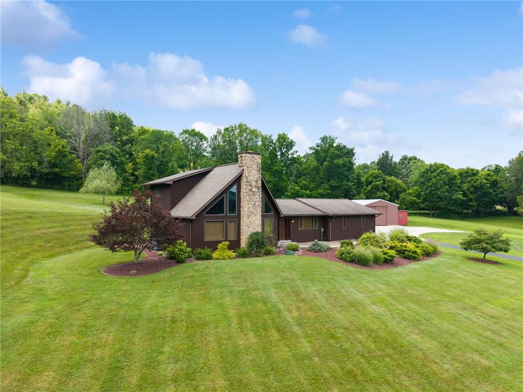 350 American Legion Road Latrobe, PA 15650 - Photo 40 of 45 a front view of a house with garden