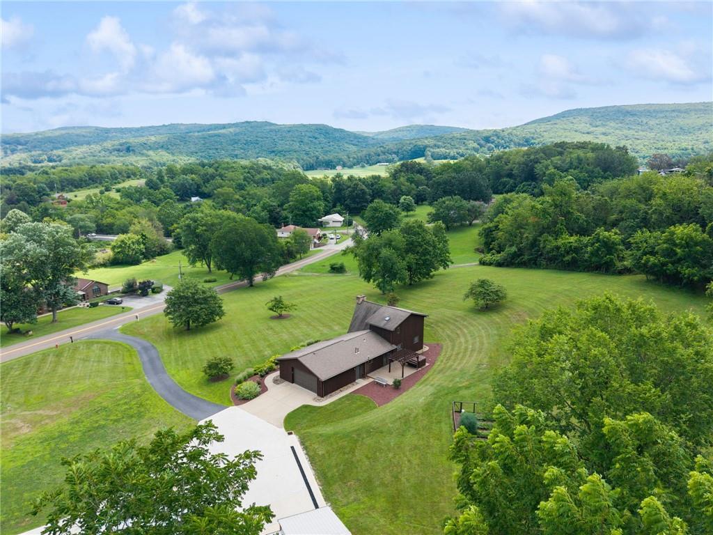 350 American Legion Road Latrobe, PA 15650 - Photo 43 of 45 a view of a garden with a building in the background