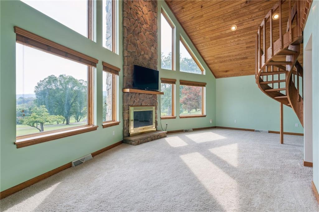 350 American Legion Road Latrobe, PA 15650 - Photo 5 of 45 a view of an empty room with a fireplace and a window