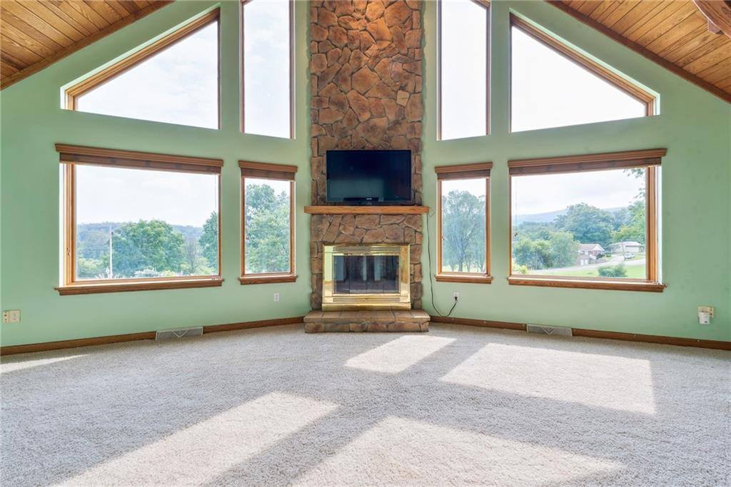 350 American Legion Road Latrobe, PA 15650 - Photo 6 of 45 a living room with a fireplace and a window