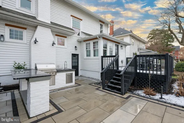 a view of a house with a bench in patio