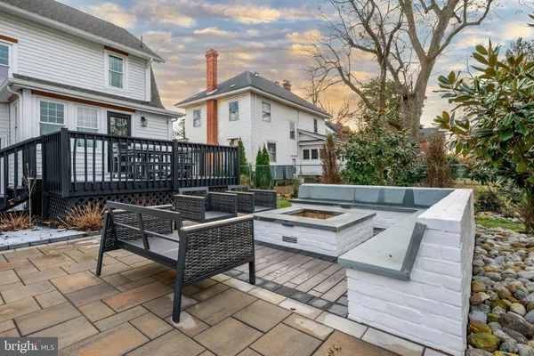 a view of a house with wooden deck