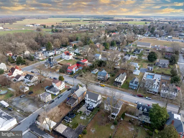 an aerial view of multiple houses with outdoor space