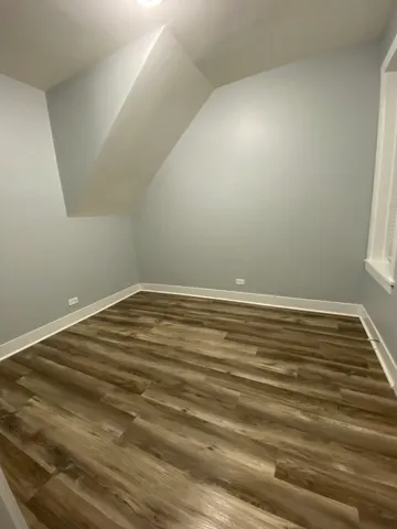 a view of room with wooden floor