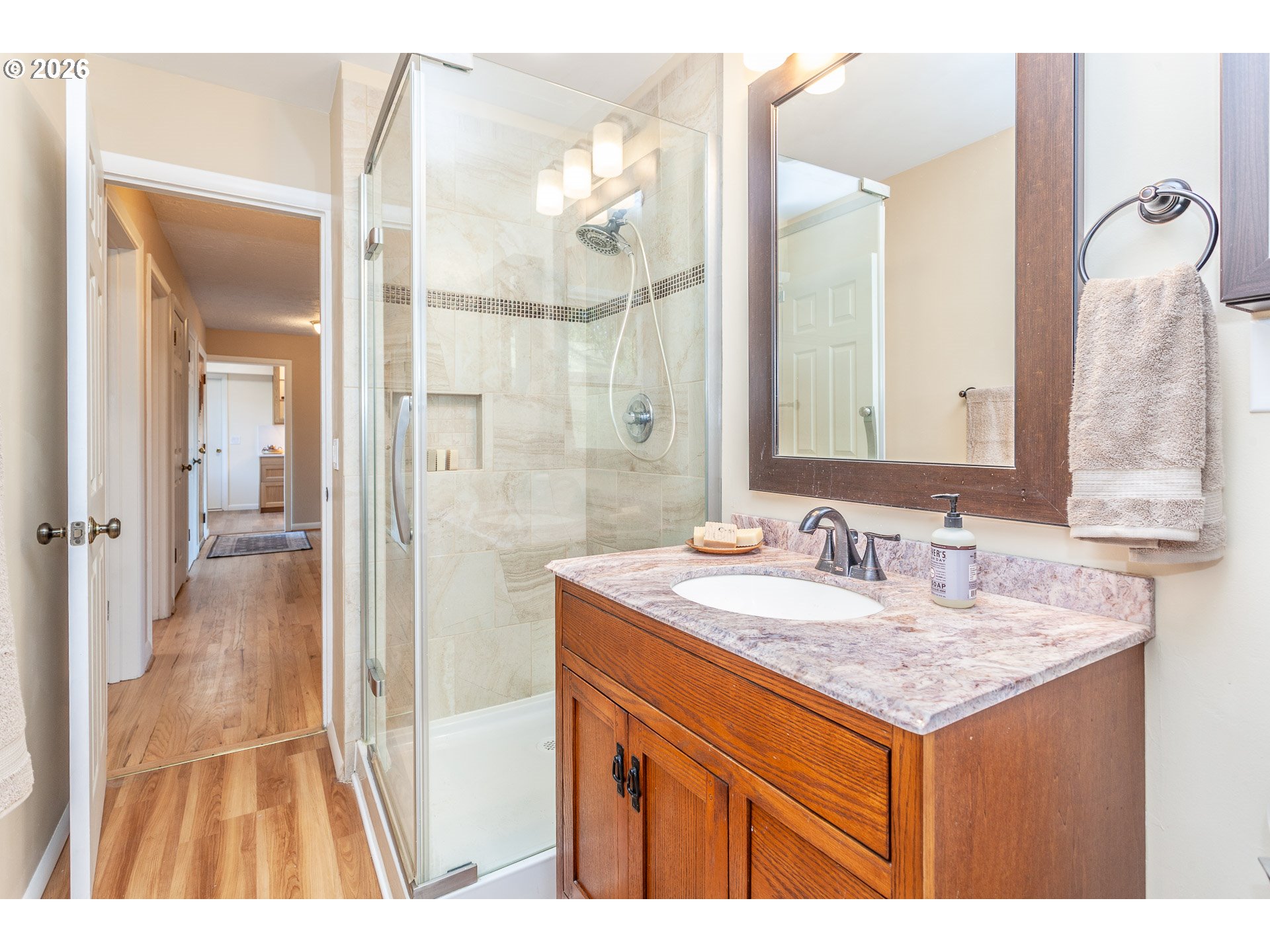 6805 Northeast Multnomah Street Portland, OR 97213 - Photo 19 of 44 a bathroom with a sink a vanity and a mirror