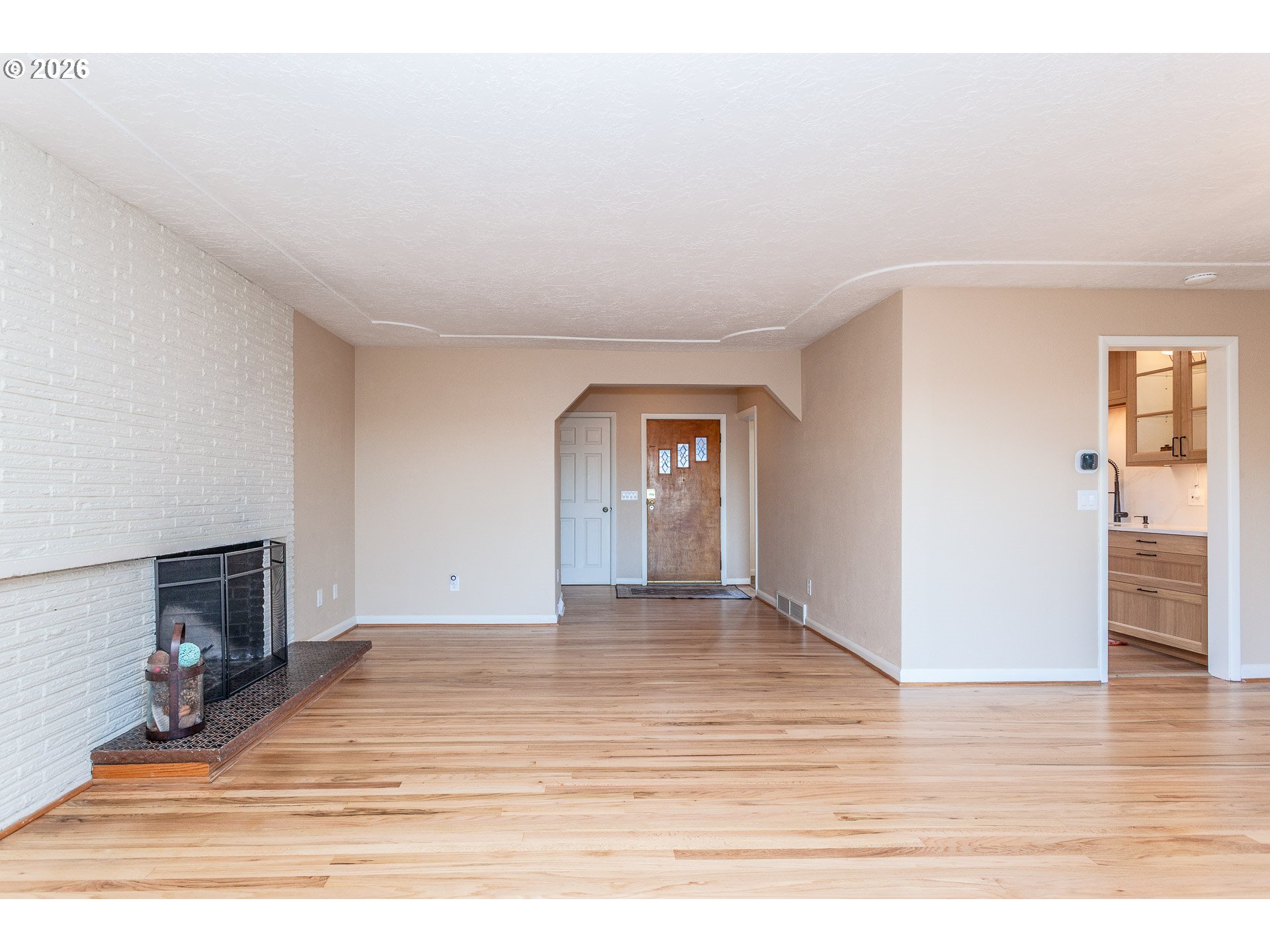 6805 Northeast Multnomah Street Portland, OR 97213 - Photo 3 of 44 a view of an empty room and wooden floor