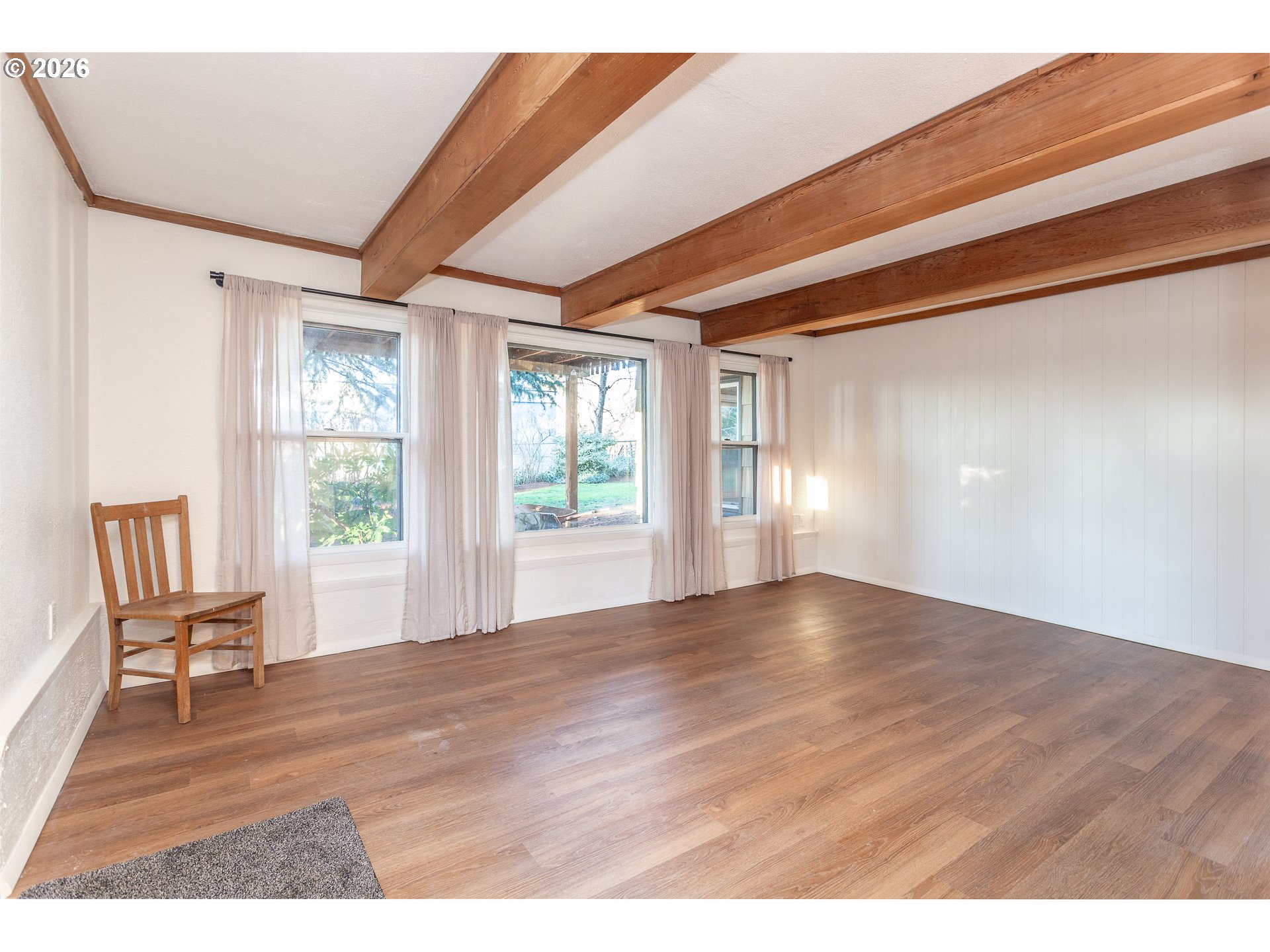6805 Northeast Multnomah Street Portland, OR 97213 - Photo 37 of 44 a view of an empty room with wooden floor and a window