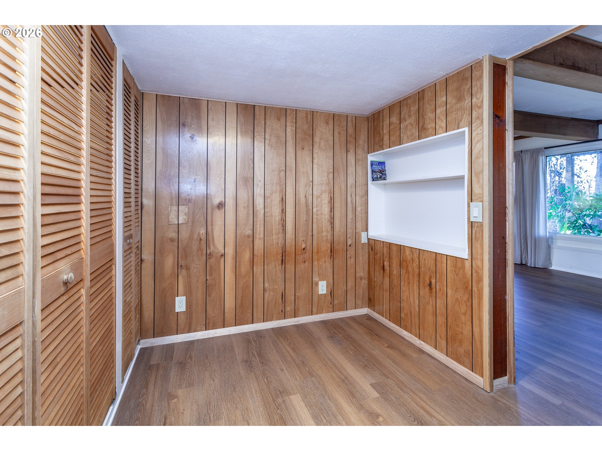 6805 Northeast Multnomah Street Portland, OR 97213 - Photo 41 of 44 a view of an empty room with wooden floor