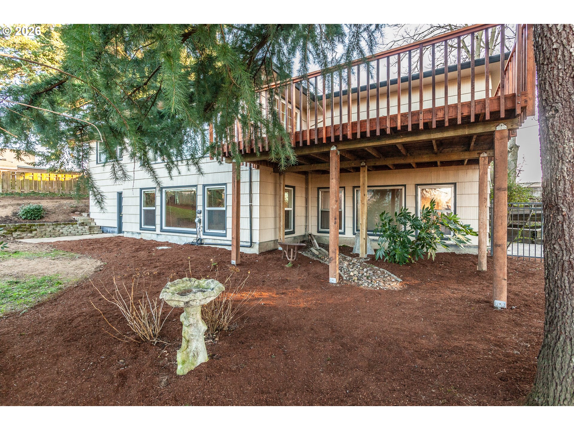 6805 Northeast Multnomah Street Portland, OR 97213 - Photo 43 of 44 a view of a house with a patio and a yard