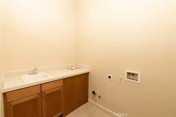a spacious bathroom with a tub sink shower and a mirror