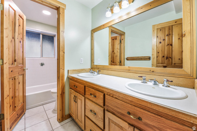 605 North Loafer Canyon Road Elk Ridge, UT 84651 - Photo 32 of 53 Full bath featuring double vanity and light tile patterned floors