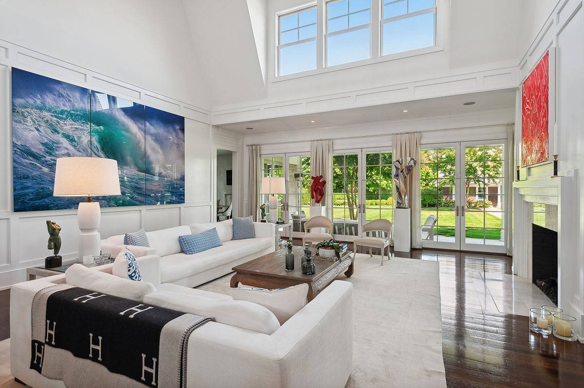 63 Newlight Lane Bridgehampton, NY 11976 - Photo 6 of 37 a living room with furniture large window and flat screen tv