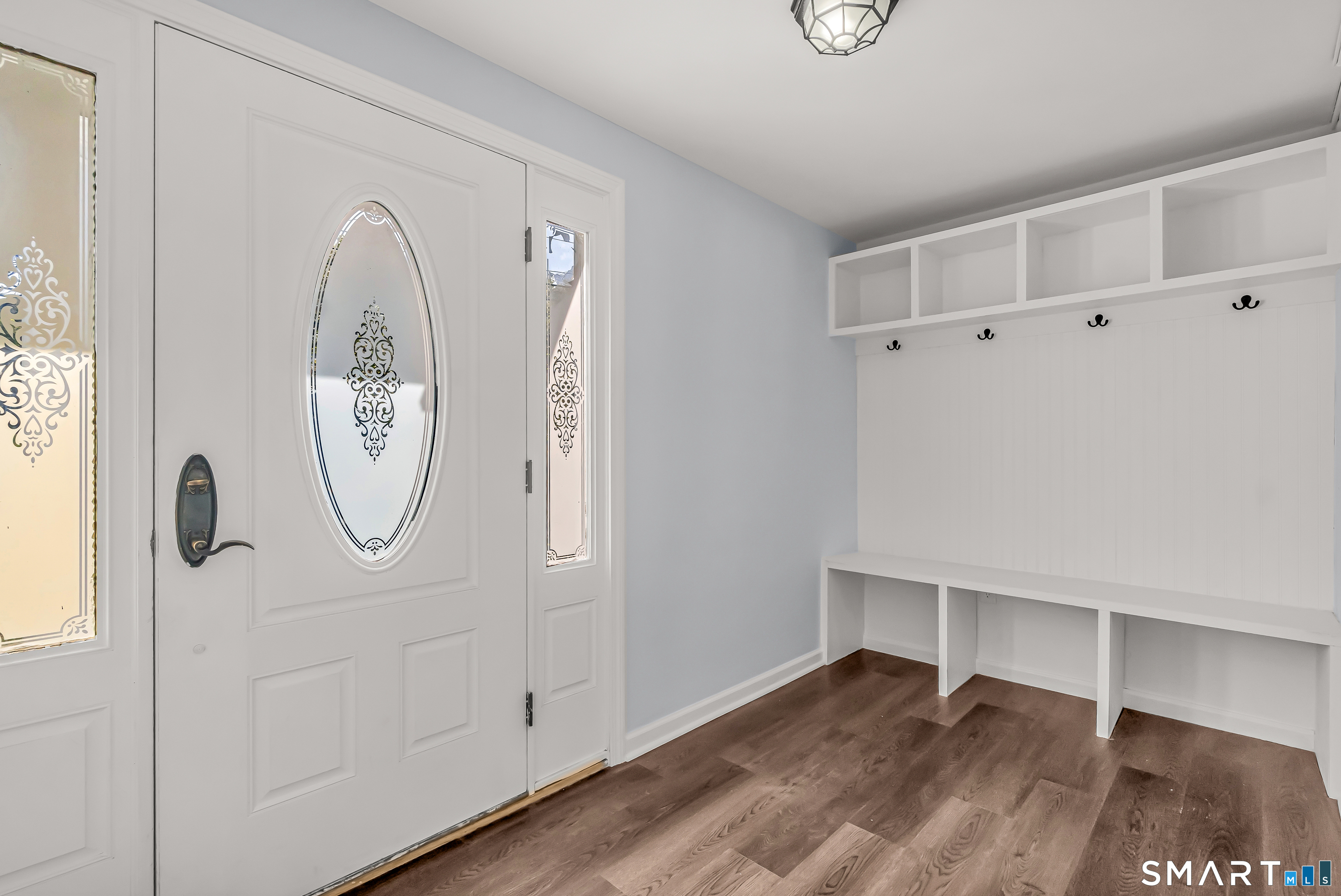 1770 Stratfield Road Fairfield, CT 06825 - Photo 3 of 40 a view of a room with wooden floor and white walls