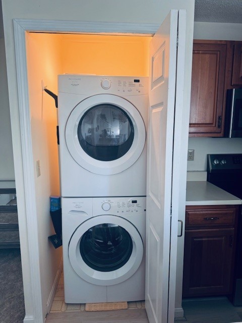140 High Street, Unit 204 Westerly, RI 02891 - Photo 13 of 20 Full sized front loader washer/ dryer located in the kitchen.