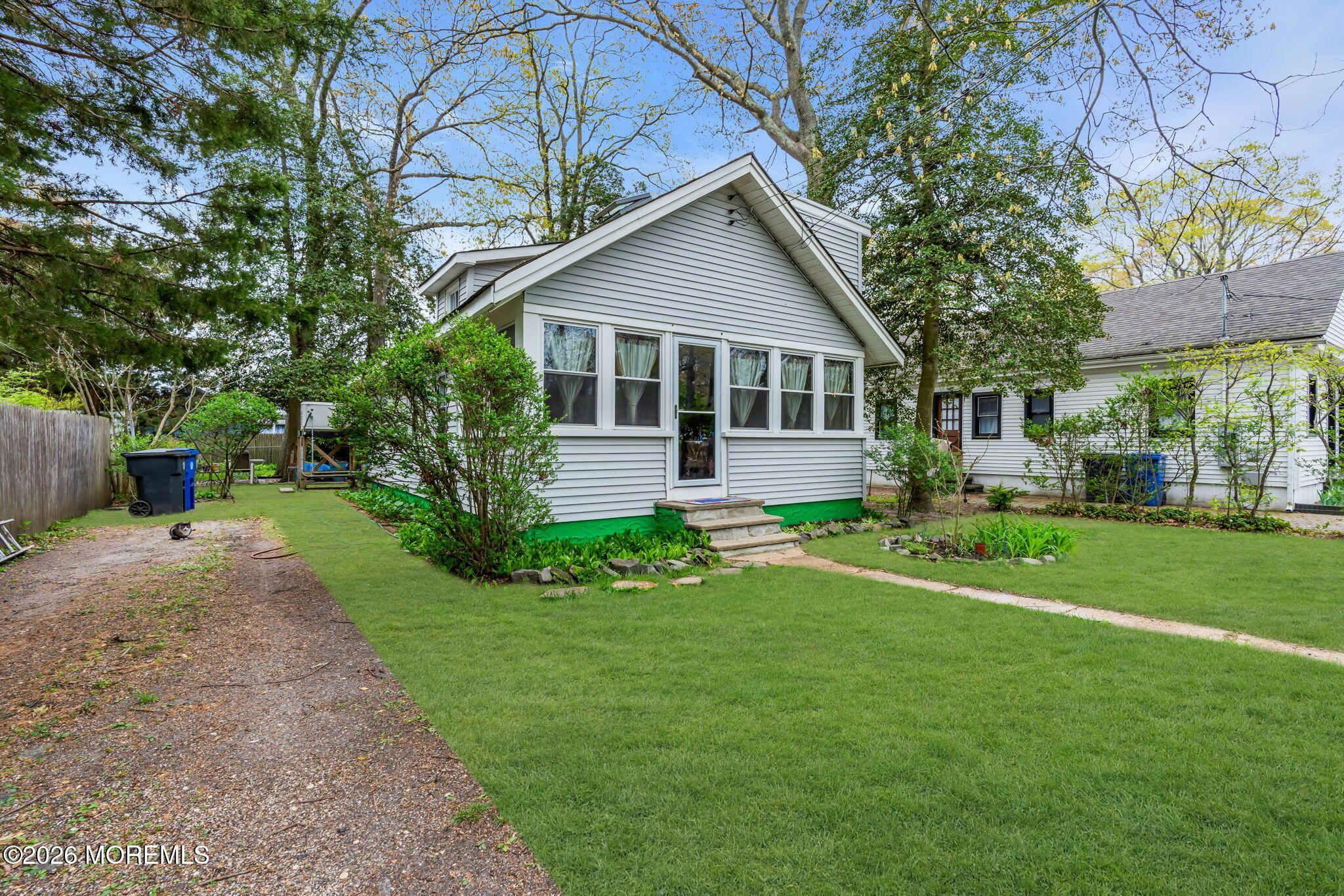 109 Martin Road Toms River, NJ 08753 - Photo 3 of 34 a front view of a house with a garden and yard