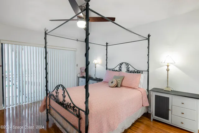 a bedroom with bed and a night stand