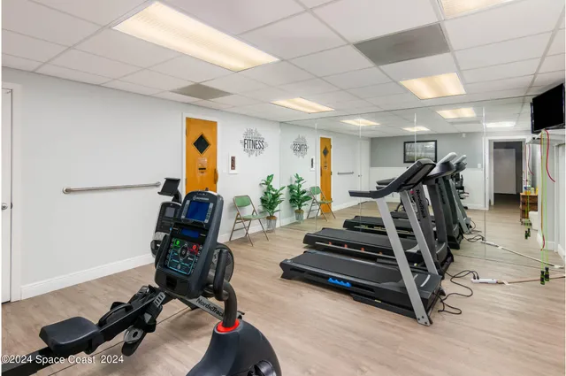 a view of a room with gym equipment