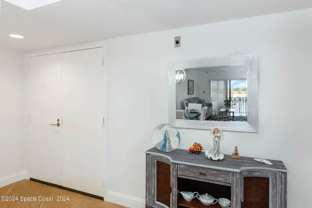 a room with a table and a mirror