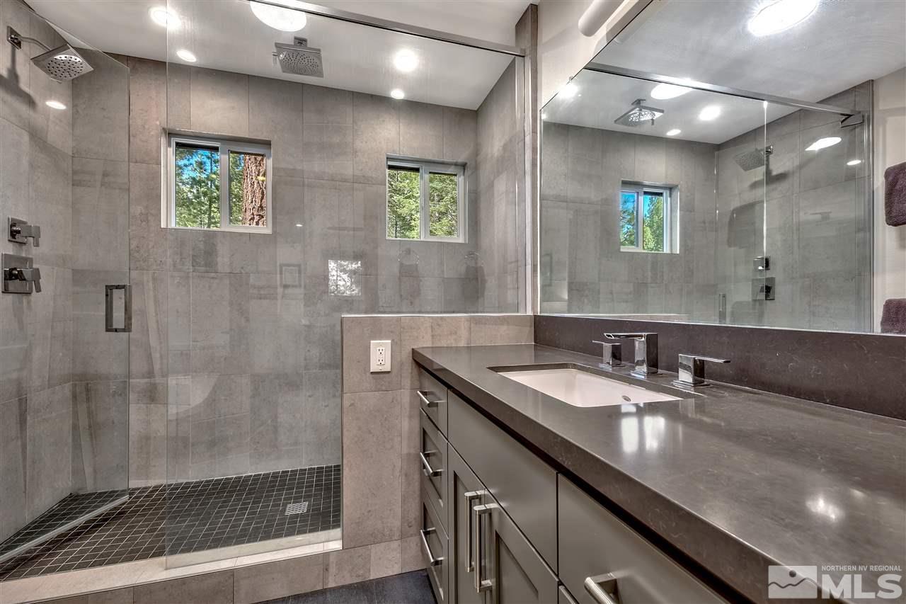259 Chimney Rock Road Stateline, NV 89449 - Photo 10 of 14 a bathroom with double sink and a mirror