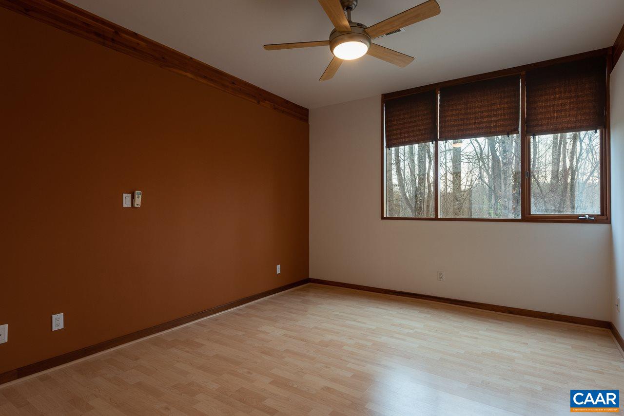 300 Turkey Ridge Road Charlottesville, VA 22903 - Photo 26 of 39 an empty room with a window