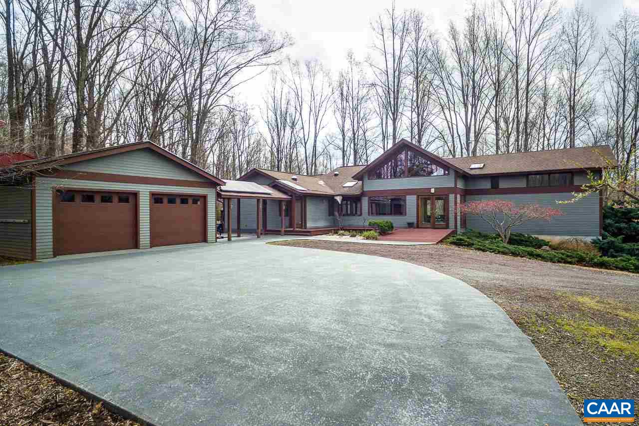 300 Turkey Ridge Road Charlottesville, VA 22903 - Photo 3 of 39 a front view of a house with a garden