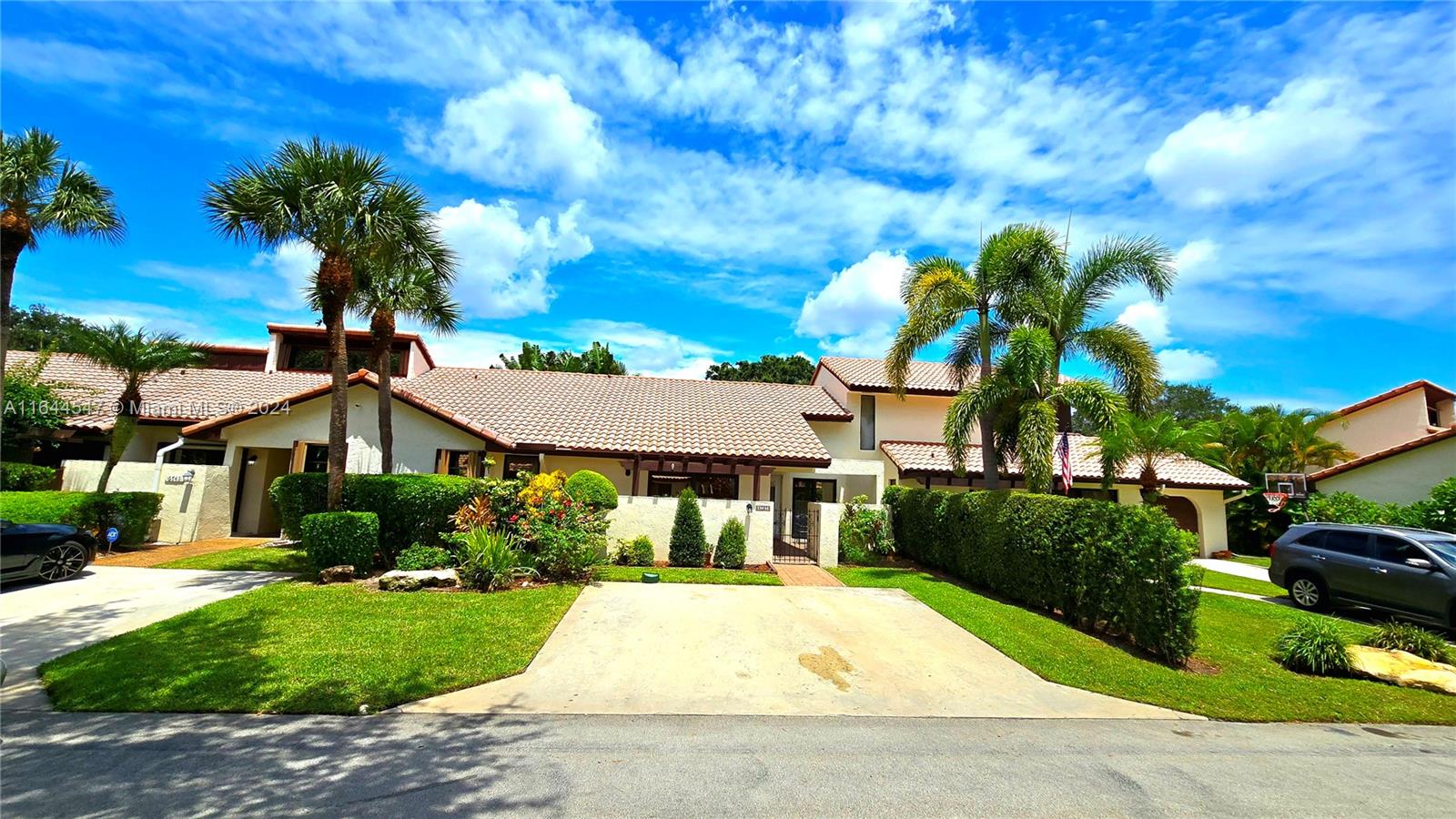 6727 Tiburon Circle Boca Raton, FL 33433 - Photo 1 of 36 a front view of a house with a yard