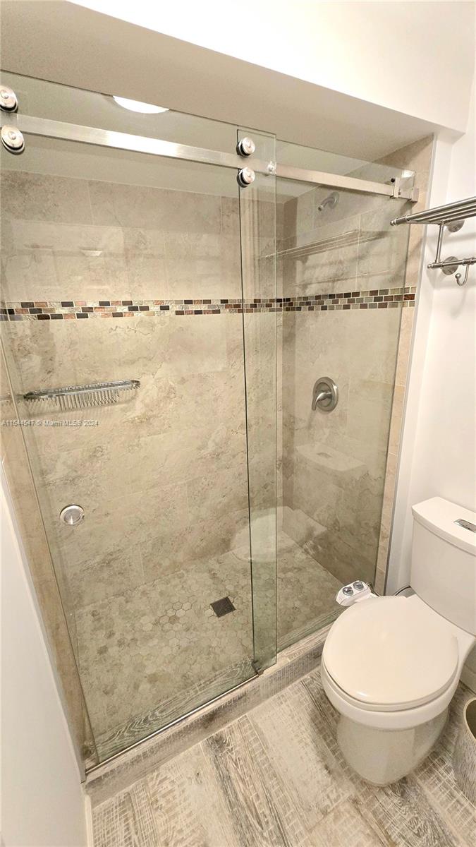 6727 Tiburon Circle Boca Raton, FL 33433 - Photo 14 of 36 a bathroom with a toilet and a shower