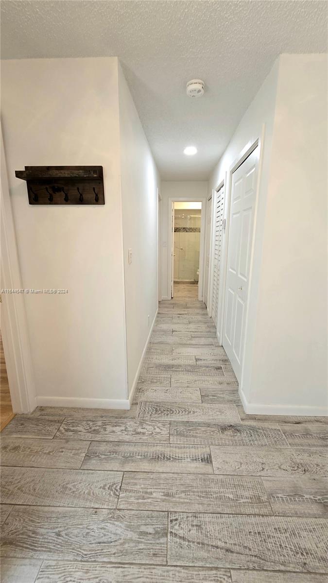6727 Tiburon Circle Boca Raton, FL 33433 - Photo 32 of 36 a view of a hallway